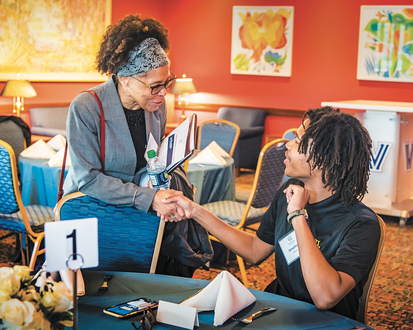 O’Toole Scholar Committee Member Dr. Teresa Nance shakes hands with O’Toole Scholar Jonathan Marte