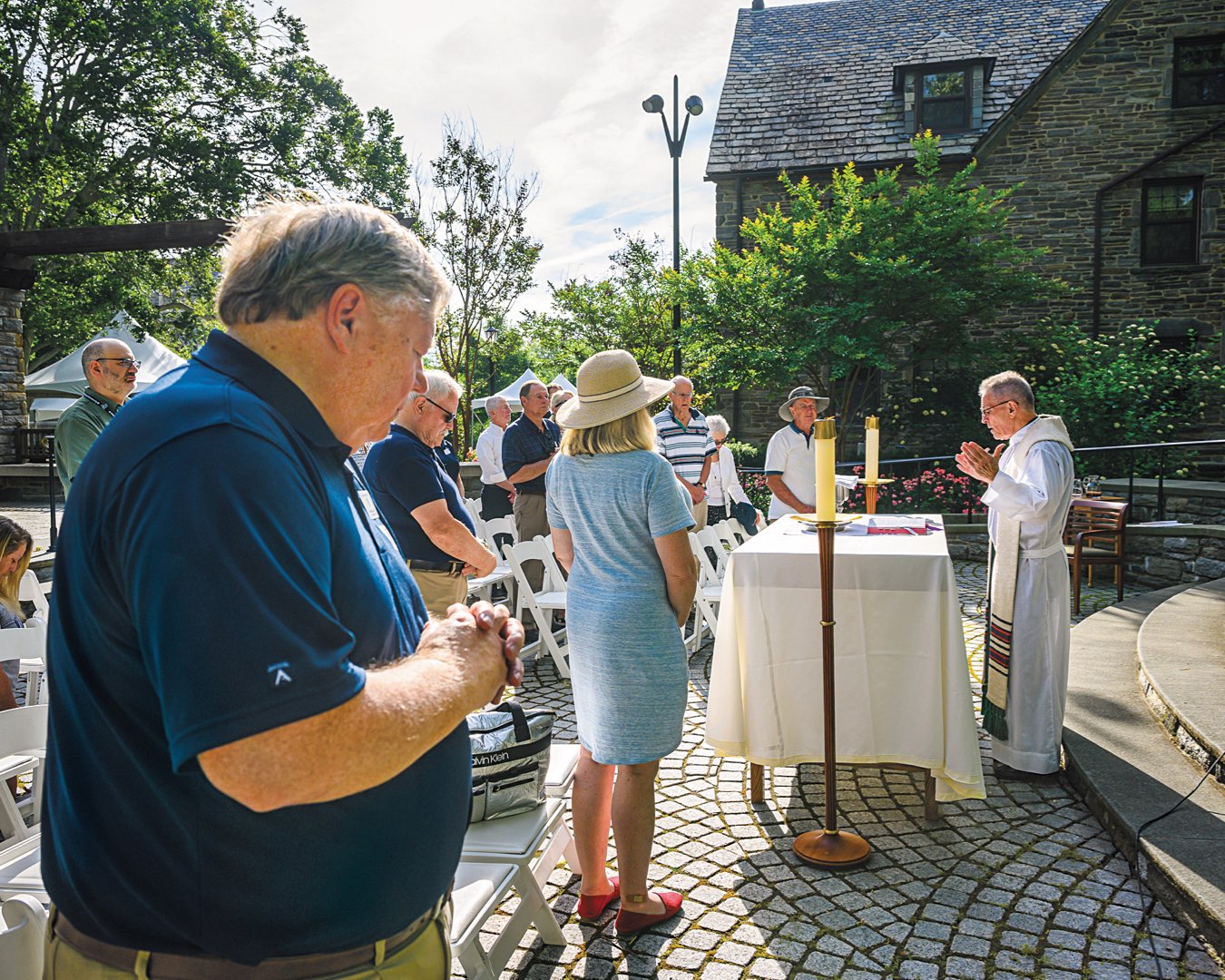 Several alumni attending an outdoor mass