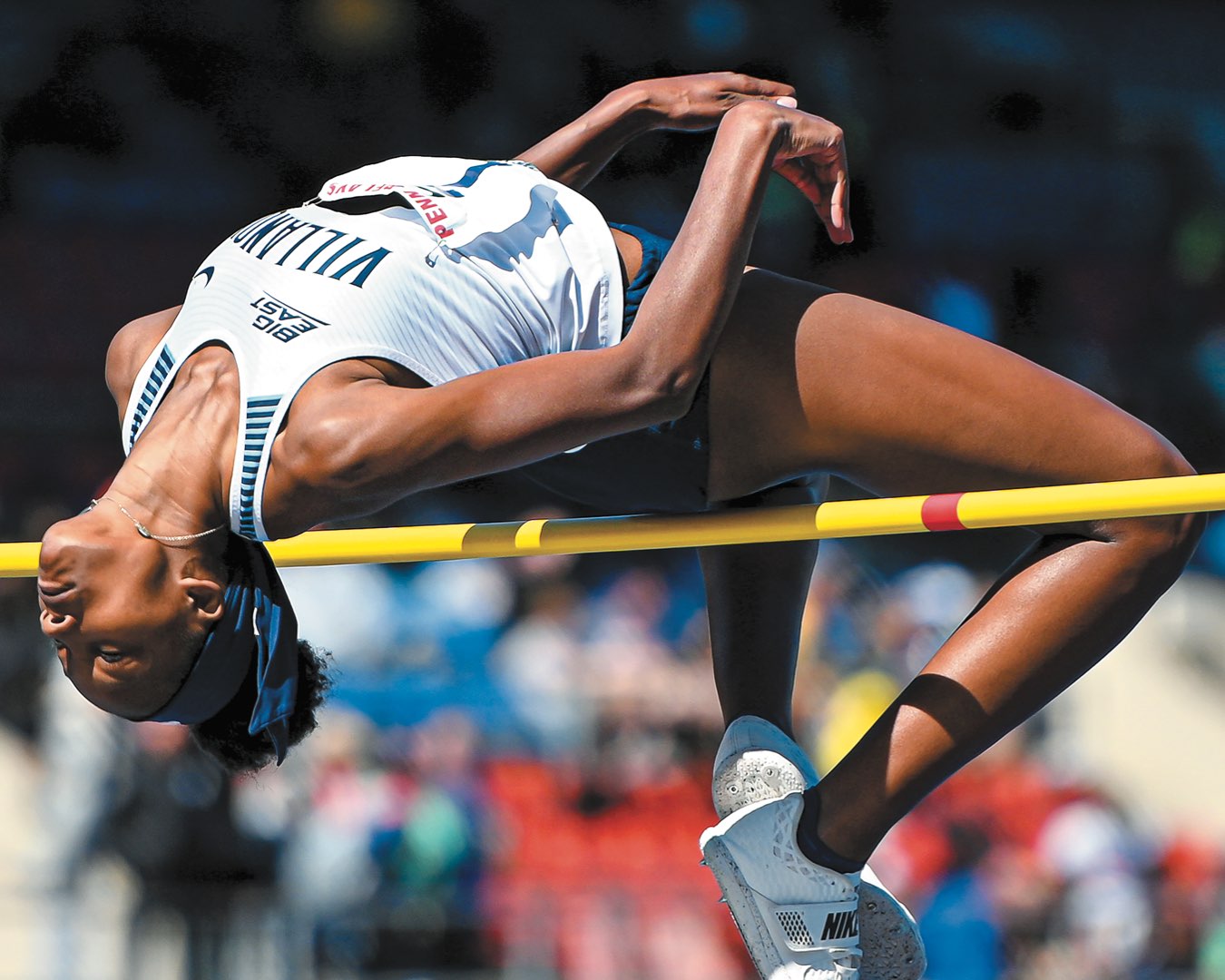 Freshman Sanaa Barnes arched over the yellow high bar in mid jump
