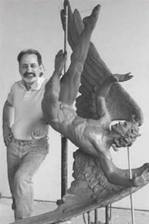 george-nista An image of George Nista standing next to one of his pieces