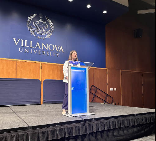 Jenna Fazio '24 CpE Jenna Fazio speaking at a lectern