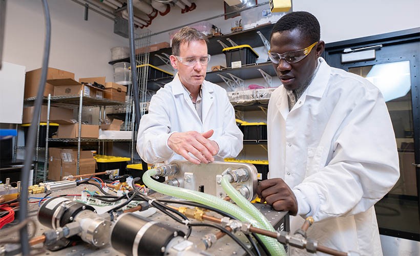 Department of Mechanical Engineering Aaron Wemhoff, PhD, and a graduate student in a Mechanical Engineering lab