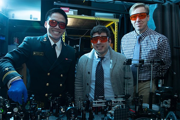 Ronald Warzoha stands with two students in the lab.