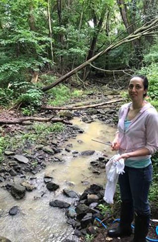 Graduate Student Emily Carambelas at the headwaters of Chrome Run Graduate Student Emily Carambelas at the headwaters of Chrome Run