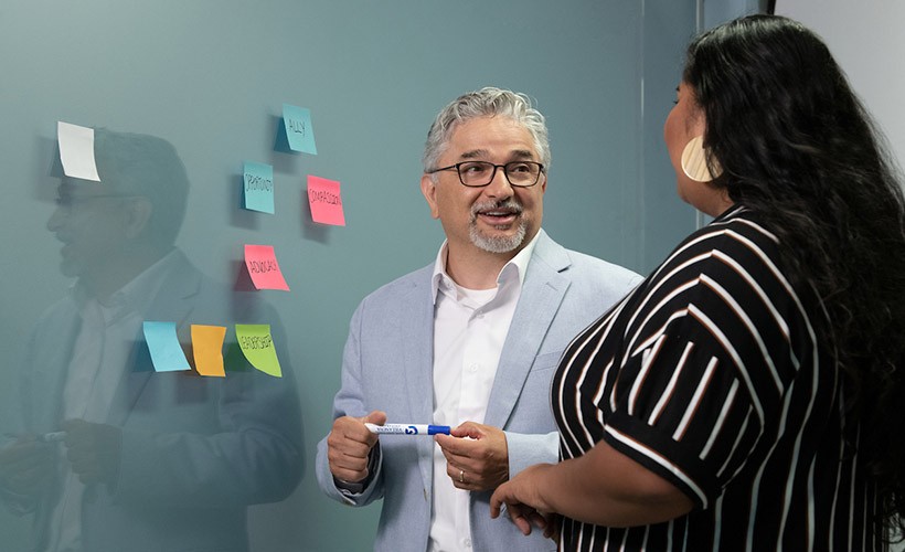 Ed Fierros, Associate Dean of Diversity, Equity and Inclusion, talks to a student. Ed Fierros, Associate Dean of Diversity, Equity and Inclusion, talks to a student.