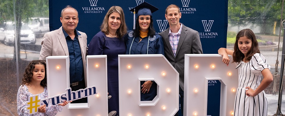 Ligia Vail '24 MS graduated this May from the Villanova master's degree program in Human Resource Develpment. (From left): daughter Isabel; father, Jairton Ribeiro; mother, Elena Ribeiro; Vail; husband, Ted; and daughter Elena. Ligia Vail '24 MS graduated this May from the Villanova master's degree program in Human Resource Develpment. (From left): daughter Isabel; father, Jairton Ribeiro; mother, Elena Ribeiro; Vail; husband, Ted; and daughter Elena.