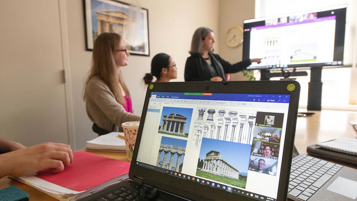 Classical Studies Program Professor lecturing students about Classics architecture.