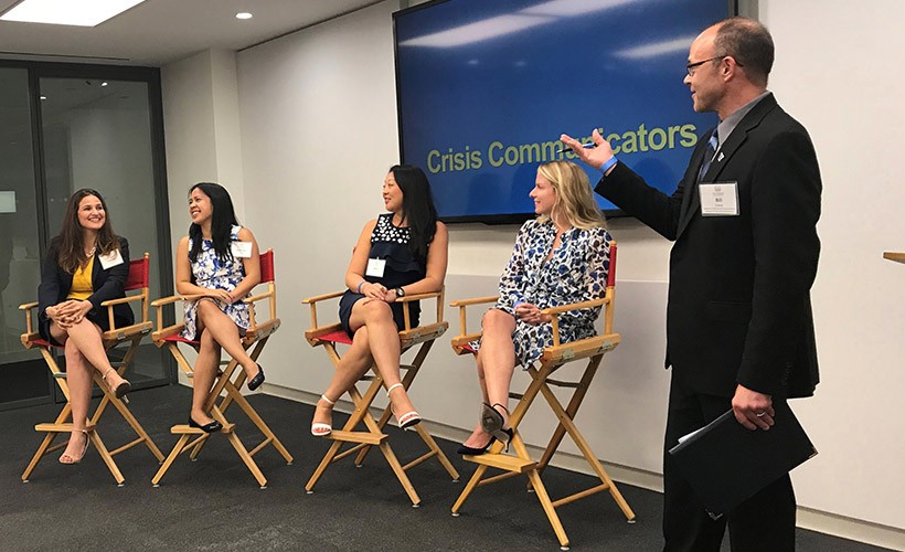 A faculty member leads an alumni panel.