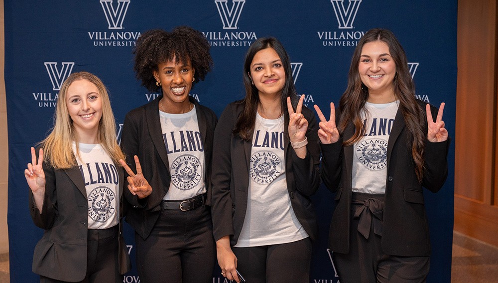 HRD students standing together at a conference HRD students standing together at a conference