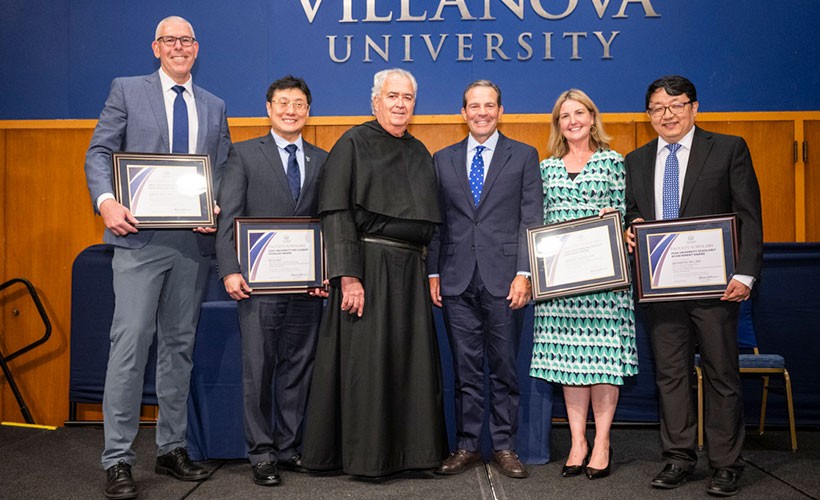Award recipients holding certificates