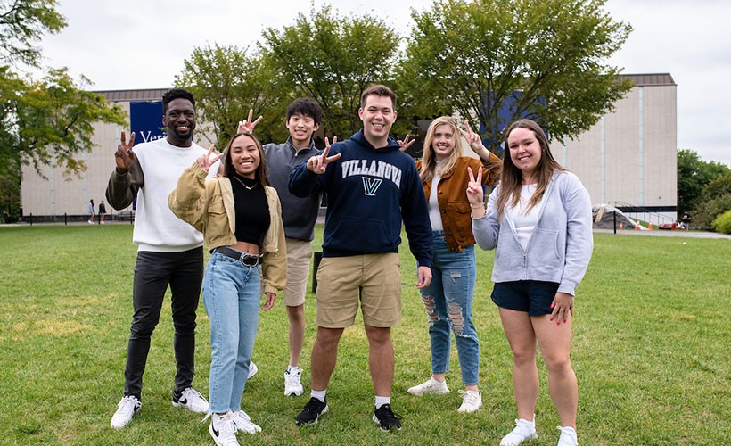 students-outside-campus-posing Students standing outside