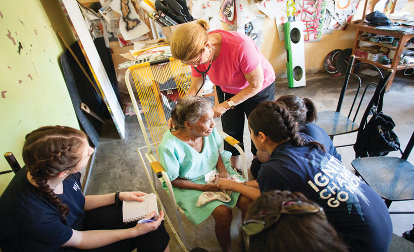 A female Villanova nursing student doing service work