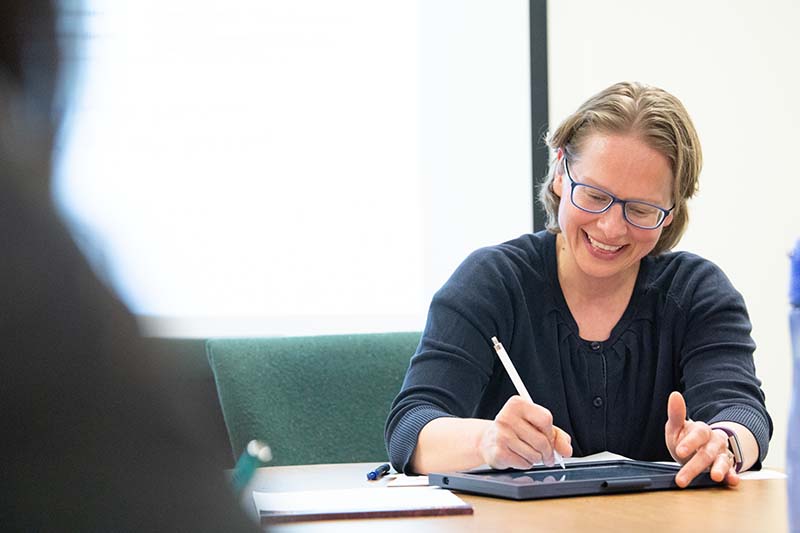 Female student learning on iPad